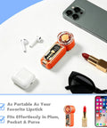 Beast Portable Handheld Fan On The Go With USB-C Rechargeable Battery beside lipstick and phone on table.