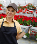 Gardener holding Japanese Weeding Sickle Hoe Garden Tool Hand Grass Sickle with High Carbon Steel Blade in greenhouse.