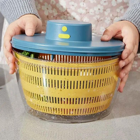 No Sweat Electric Salad Spinner With Single Button Control For Swift Leafy Greens Washing And Thorough Fruit Vegetable Drying Generous Four Liter Capacity held with lid on, showcasing spinning basket.