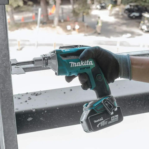 Hand holding 18V LXT Brushless Cordless Drywall Screwdriver Bare Tool With Push Drive Technology And Lock On Mode Delivers 0 To 4000 RPM