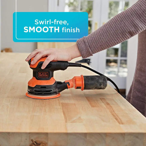 Person using Random Orbit Sander 5 Inch 2.4 Amp with Built In Dust Bag, Adjustable 3 Position Grip on wood for smooth finish
