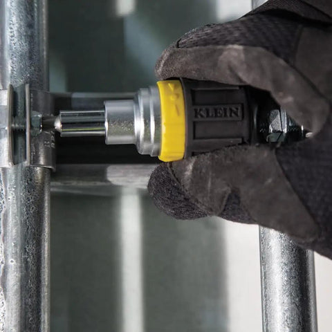 Compact Six In One Stubby Ratcheting Screwdriver With Phillips And Slotted Bits Plus One Quarter Inch And Three Sixteenth Inch Nut Drivers Cushioned Grip For Maximum Torque And Comfort Pro Grade Ideal For Tight Spots From Klein Tools being used in tight space
