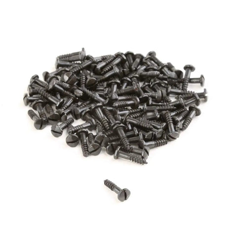 Pile of slotted pyramid head screws five eighths inch steel black coated, heavy duty wood fasteners pack of one hundred.