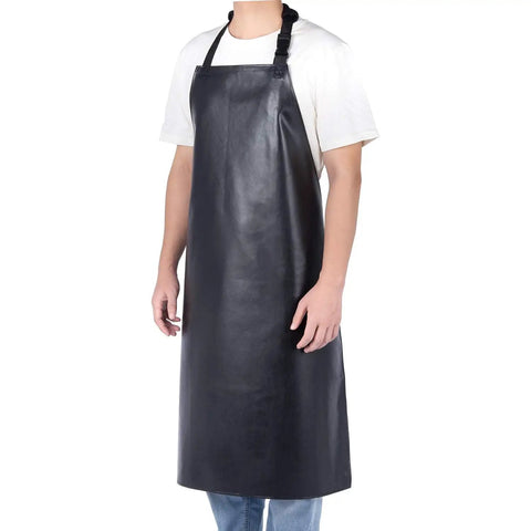 Person wearing unisex heavy duty vinyl waterproof apron, oil and liquid resistant, workwear, 39 x 28 inches, in black color.