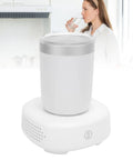 Smart Electric Heating And Cooling Coffee Mug with Precise Digital Temp Regulator on base, styled in a modern kitchen.