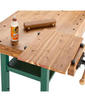 Heavy Duty Solid Oak Workbench With Bulletproof Steel Legs And Dual Vise Setup Featuring Smooth Riding Storage Drawers Plus Removable Bench Dogs, detailed view of the oak surface and storage.