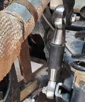 Close-up of Beefed Up 1/2 Inch Heim Joints Rod End Kit with Chromoly Panhard adapter installed on vehicle suspension system
