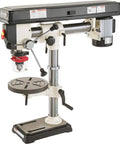 No-Fuss Shop Floor Beast Benchtop Radial Drill Press featuring 1/2 horsepower motor and 5/8 inch chuck on a workbench.