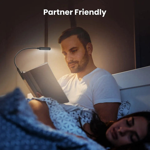 Man reading in bed with Clip On Rechargeable Book Light Set 2 Pack For Bedtime Or Late Night Reading LED Reading Lights