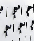 Standard Slotted Hook Pack For Pegboard And Slotted Tool Boards, Heavy Duty Metal Hooks With Black Finish, mounted on board