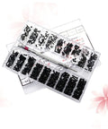 Top Tier Mini Screw Assortment Kit With 18 Assorted Sizes High Hardness Carbon Steel Black Fasteners For Phone Repair Hobby Builds And Everyday Fixes That Really Step Up Your Toolbox Game, displaying black screws and a screwdriver.