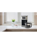 Programmable Dome Brew Coffee Maker Featuring Twenty Four Hour Timer Backup Memory And Sleek Stainless Steel Finish on kitchen counter.