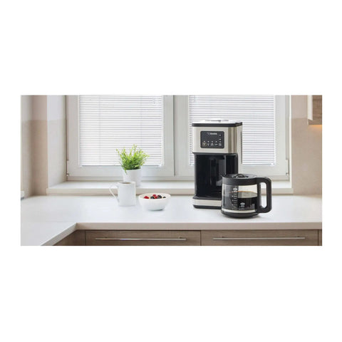 Programmable Dome Brew Coffee Maker Featuring Twenty Four Hour Timer Backup Memory And Sleek Stainless Steel Finish on kitchen counter.