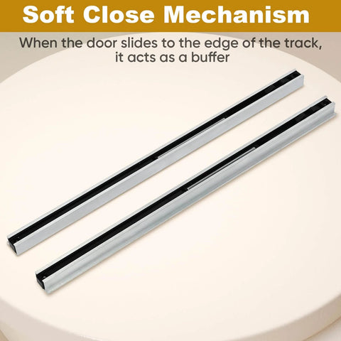 Close-up of soft close mechanism for Hidden Barn Door Hardware Kit With 48 Inch Track System Heavy Duty Quiet Roll Interior Door Track Kit Fits One And A Quarter Inch To One And Three Quarter Inch Thick Doors And Supports Up To 176 Pounds. Silver tracks on table.