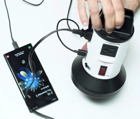 Person using 4 Outlet Power Strip With 6 USB Ports, 360 Degree Swivel, Surge Protector to charge smartphone