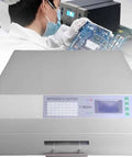 Technician using fully automatic hot air reflow soldering machine with infrared heating for PCBs SMD SMT BGA rework station tool.