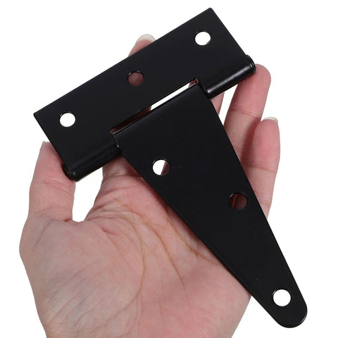 Hand holding Beefy Heavy Duty Extended Door Hinge With Ball Bearing For Wooden Gates And Barn Doors Black Industrial Strap Hinges