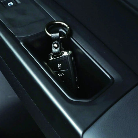 Volkswagen Atlas 4 Piece Armrest Door Storage Organizer Box Tray Handle Set shown with car key inside