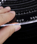Clear acrylic center finder compass for wood turning, 300 mm diameter with measurement scale.