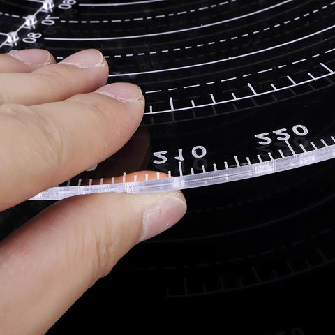 Clear acrylic center finder compass for wood turning, 300 mm diameter with measurement scale.