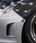 Installed view of Universal Quick Release Fastener Kit With Neo Chrome Finish For Bumpers, Trunks, Fenders And Hatches, Fits Most Cars From JDM To American Muscle, Multi Color Anodized Aluminum Hardware.
