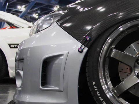 Installed view of Universal Quick Release Fastener Kit With Neo Chrome Finish For Bumpers, Trunks, Fenders And Hatches, Fits Most Cars From JDM To American Muscle, Multi Color Anodized Aluminum Hardware.