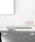 Heavy Duty Aluminum Under Desk Laptop Mount and Tablet Clamp Stand Featuring Multi Functional Design and Strong Support Rock Solid Computer Holder With No Fuss Setup for a Clean Office Vibe That Hits Different displayed under a modern desk.