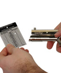 Heavy Duty Handheld Workhorse Single Hole Punch With 1/8 Inch Punch And 2 Inch Reach punching a fire extinguisher inspection card