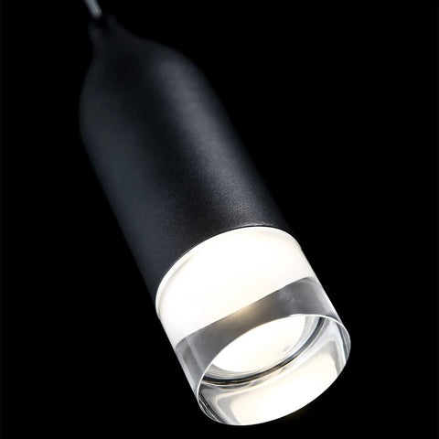Close-up of Action 8-In LED Pendant Light 3000K Black With Dope Retro Spun Metal Housing, sleek design with illuminated end.