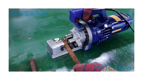 Portable Electric Rebar Cutter And Bender Tool for construction sites cutting deformed rebar with Hydra RC25 machine on green surface