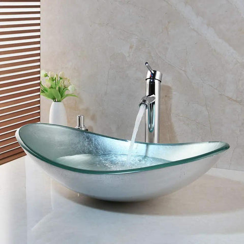 Artistic Tempered Glass Oval Vessel Sink Above Counter with Chrome Faucet and Pop Up Drain in Silver Finish Durable Brass Faucet Smooth Glass Basin