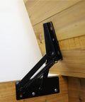 80 Degree Spring Lift Top Hinge for cabinets and beds in steel, mounted on wooden panel showcasing sturdy lift mechanism.