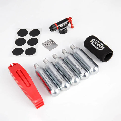 CO2 Inflator Kit With Five 16g CO2 Cartridges Presta And Schrader Valve Compatible Portable Bike Tire Pump With Insulated Sleeve Glueless Patch Kit And Tire Levers For Quick Flat Fix On Road And Mountain Bikes image showing inflator, cartridges, patch kit and levers.