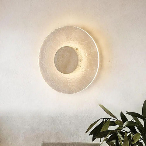 Wall Sconce Modern Indoor Round LED Nordic Hall Natural Stone Vintage Industrial Hallway Fixture Yellow Travertine Mid Century Farmhouse for Living Room Bedside against a light wall.