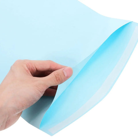 Hand holding self adhesive light blue envelope from 15 pack for letter sized documents thickened paper pockets easy to use