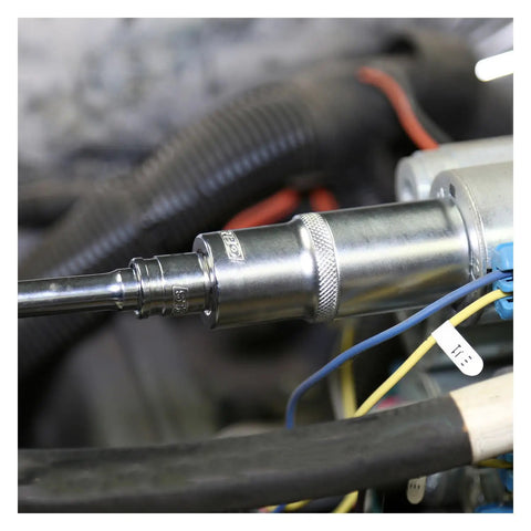 Half Inch Drive Deep Socket One And One Sixteenth Inch Six Point For Tight Access And Solid Torque Chrome Finish PosiGrip Automotive Hand Tool on an engine