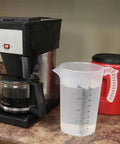 Clear 64 Ounces Measuring Pitcher With Translucent Body Raised Black Graduation Markings In Ounces And Metric Versatile Spout