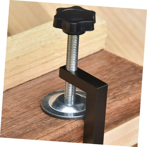 Close-up of 2-Pack Patio Clips Adjustable Fasteners for Wicker Sectional Sofas and Rattan Chairs on wood surface