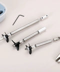 RC Boat Drive Shaft Kit With 36mm Propeller And Universal Joint, 100mm Shaft, 25mm Sleeve, shown with tools on a table.