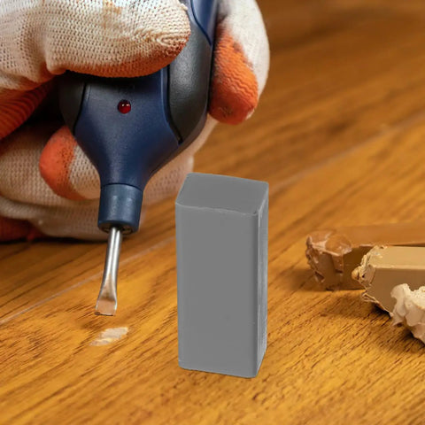 Close-up of wood floor and furniture repair kit with durable wax blocks for quick scratch fixes on hardwood laminate.