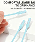 Hand holding blue silicone brush of 2-In-1 Nasal Hair Cutter With Double Sided Nose Hair Knife, ergonomic grip, and soft cleaning brush.