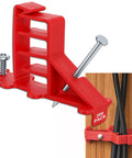 Get These 200 Pack Multi Cable Staples With Steel Nails To Secure Your Electrical Wire Stackers Fast Without Drilling And Lock Clips Keep Cables From Slipping So Your Setup Looks Clean And Super Stable - Red plastic cable staple with steel nail holding wires against wood.