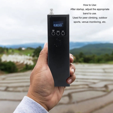 Person holding Grab And Go Portable Ham Radio Receiver Handheld 0.5MHz To 30MHz SSB Transceiver outdoors with a scenic background.