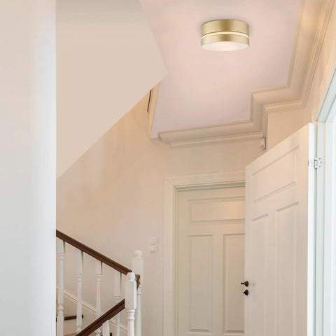 Soft Gold Finish Two Light Flush Mount Ceiling Light With Frosted Glass Shade Minimalist Glam Style in a modern hallway.