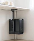 Tough As Nails Under Desk CPU Bracket holding a black desktop tower, adjustable height and width, securing space under a desk.