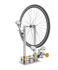 Beefy Pro Grade Heavy Duty Bicycle Wheel Truing Stand for 10 to 29 Inch Rims with aluminum and steel platform in use