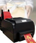 Fast 150mm/S Satin Ribbon Printer Machine With High Speed Label Maker printing red ribbons for gift wrapping.