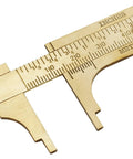 Close-up of Brass Pocket Vernier Caliper Ruler, Handy Sliding Gauge with dual MM and Inch scales for precise measurement, 100mm tool.
