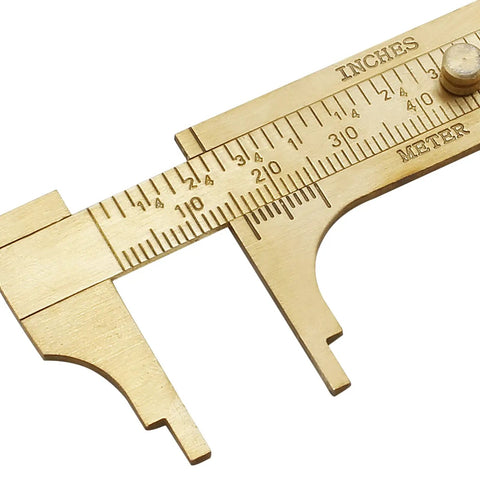 Close-up of Brass Pocket Vernier Caliper Ruler, Handy Sliding Gauge with dual MM and Inch scales for precise measurement, 100mm tool.