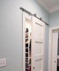 Heavy Duty Stainless Steel Sliding Barn Door Hardware Kit With 6.6ft Track For A Single Door Indoor Outdoor Rail System Delivers Smooth Operation Built To Last Modern Home Upgrade For Style And Function installed in a closet opening